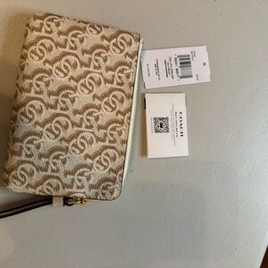 Coach Cream and Tan Monogram Clutch